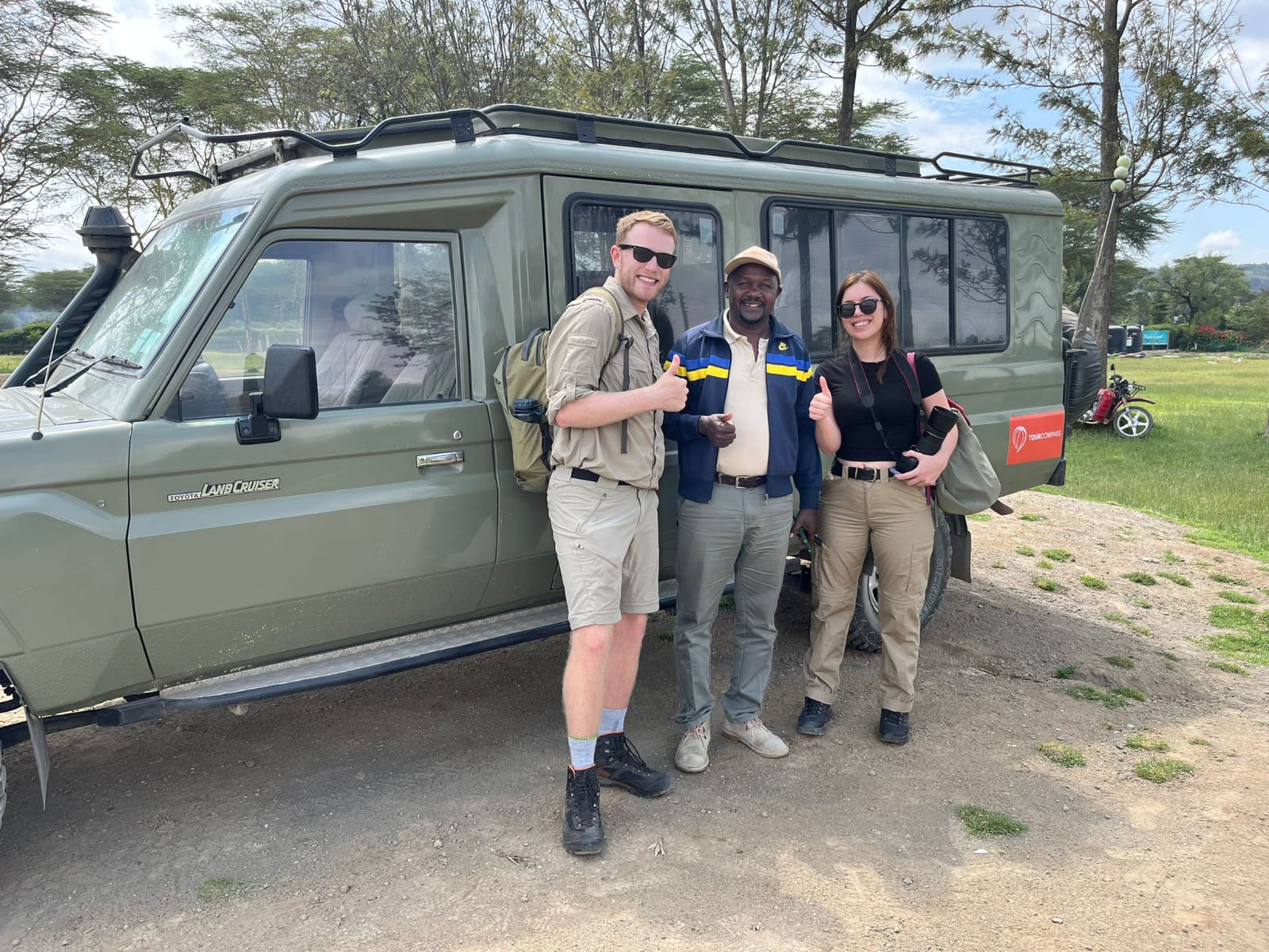 Safari guests on vehicle